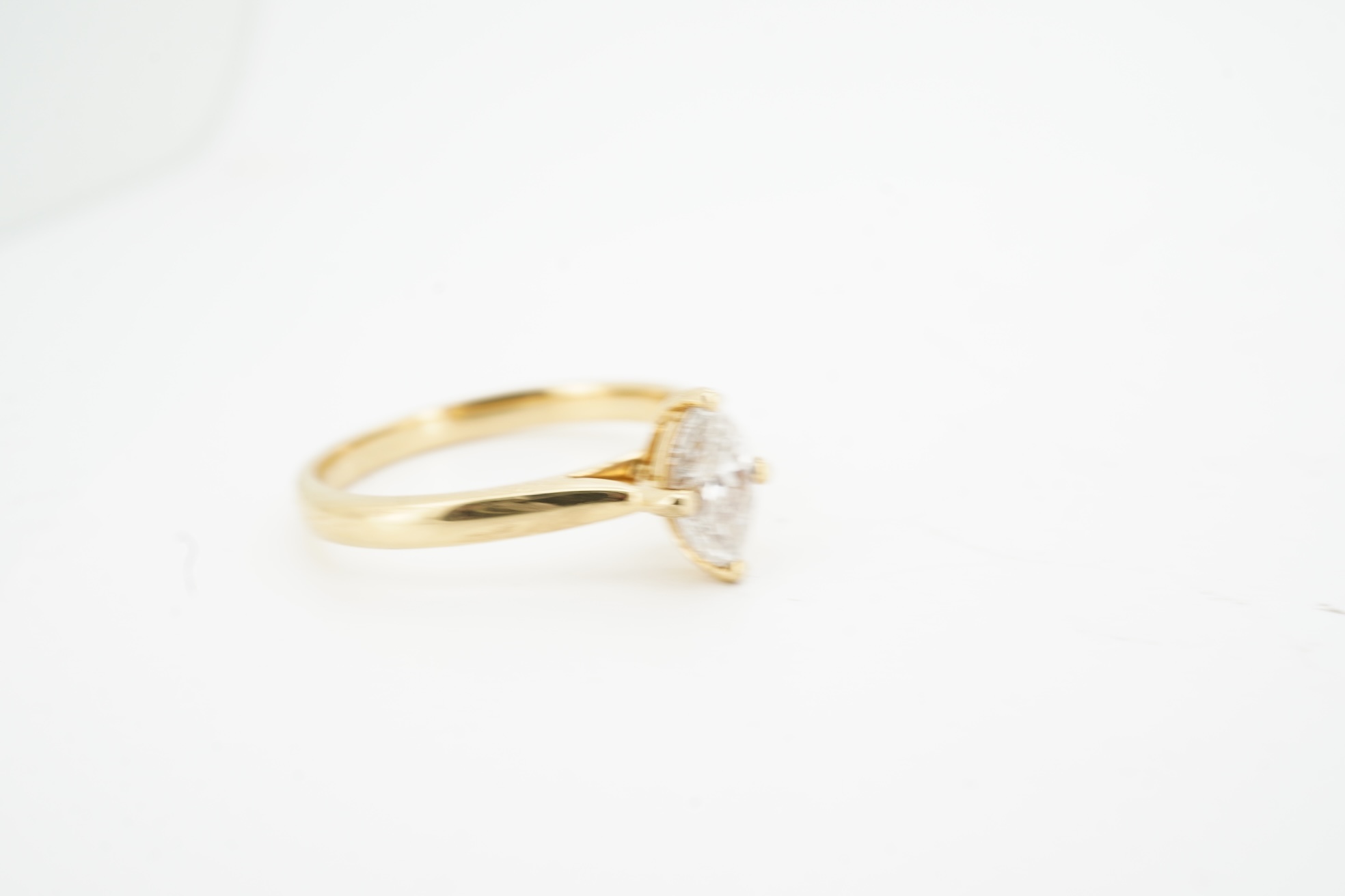 A diamond ring, claw-set with a marquise-shaped diamond weighing approximately 0.70 carats, mounted in gold, size L1/2, gross weight approximately 3 grams